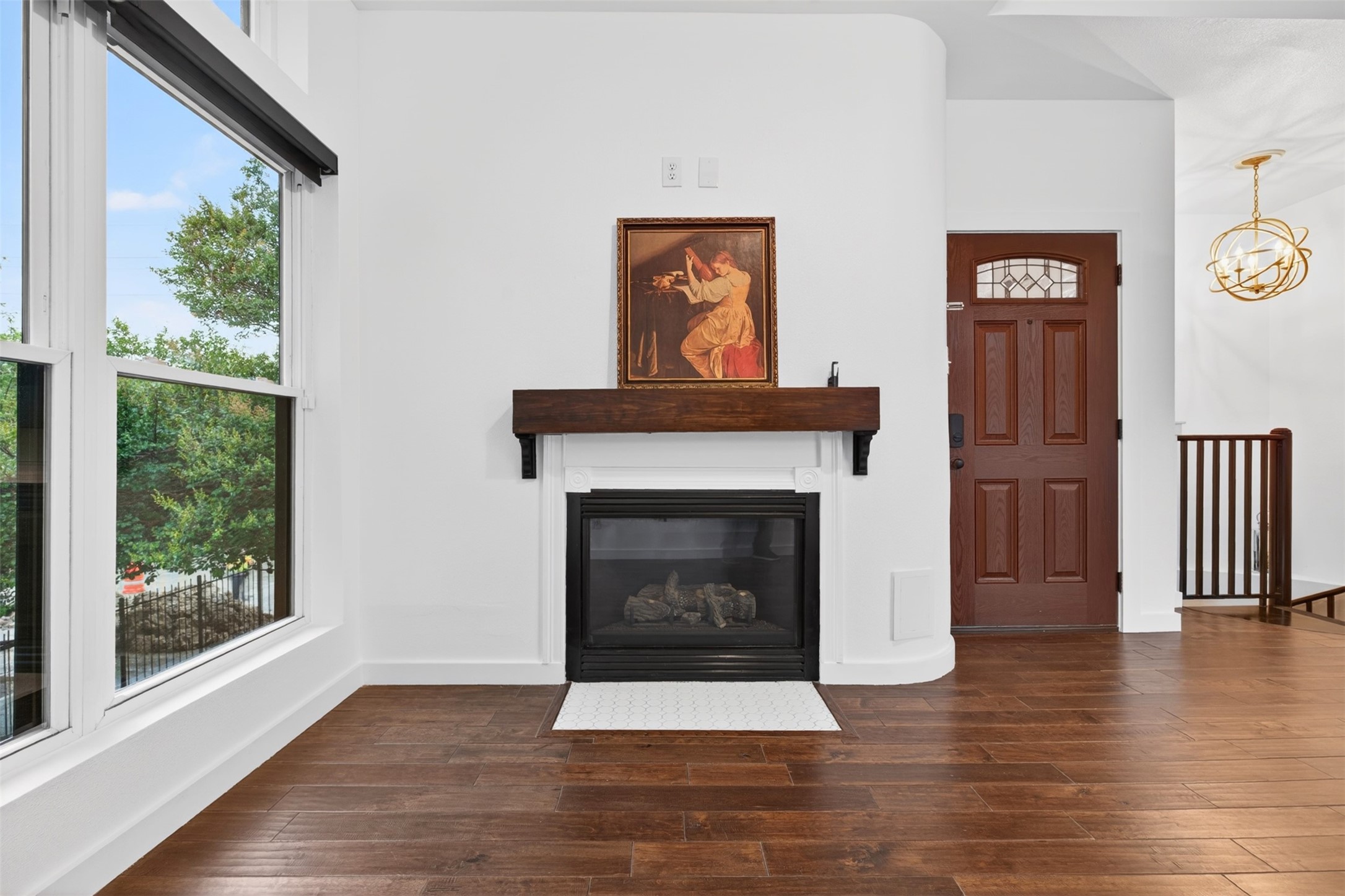 2716 Bagby Street Houston, TX 77006 - Photo 8 of 29 a living room with wooden floor and a fireplace