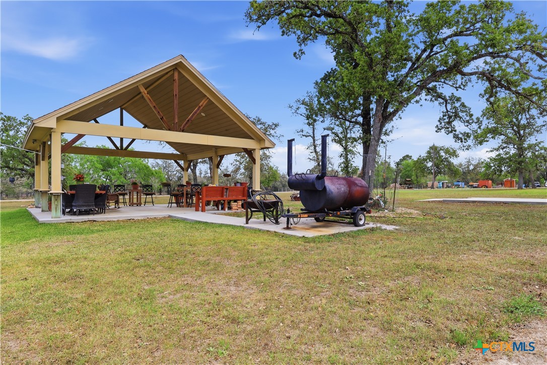 790 Spanish Grant Road Goliad, TX 77963 - Photo 34 of 41 a view of a table and chairs in the patio