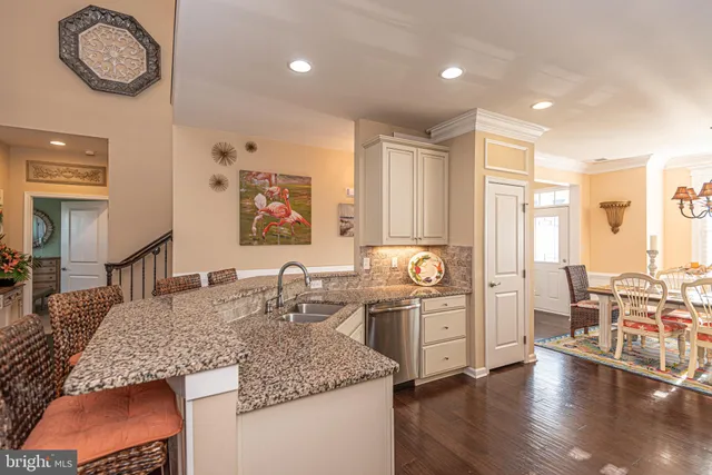a living room with fireplace furniture and a chandelier