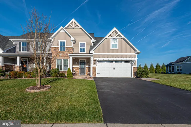 a view of balcony with two chairs and a potted plant