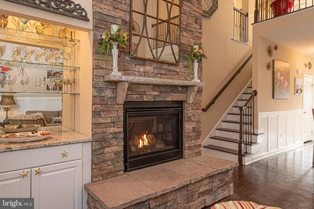 a bedroom with a bed a chandelier and a chandelier