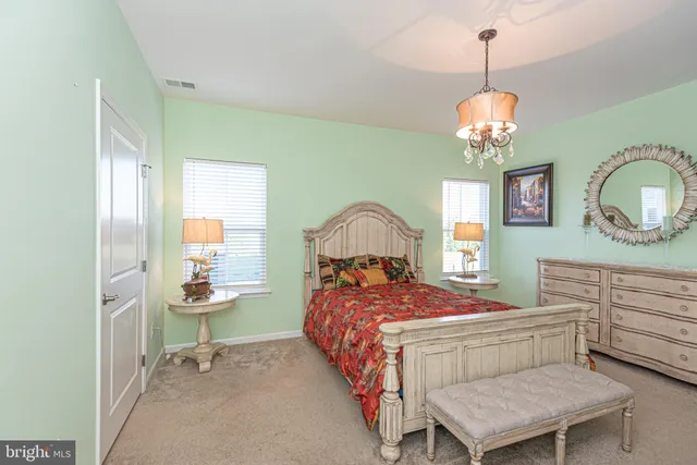 a view of a patio with table and chairs and potted plants