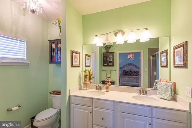 a aerial view of residential houses with outdoor space and trees