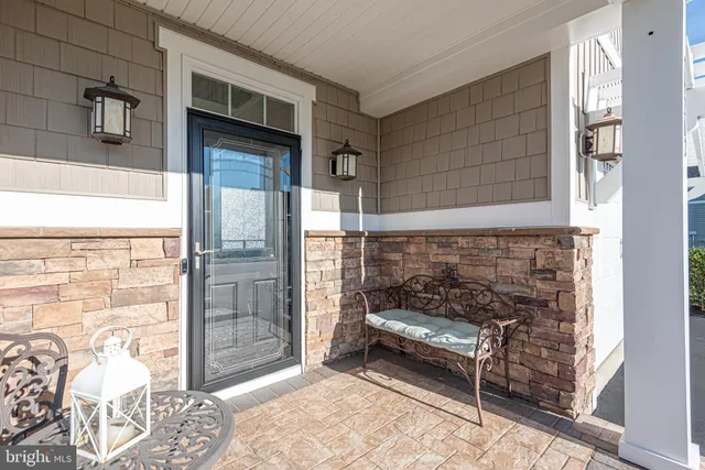 a kitchen with stainless steel appliances granite countertop a stove and a large window