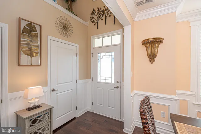 a kitchen with stainless steel appliances granite countertop a refrigerator a stove and a sink