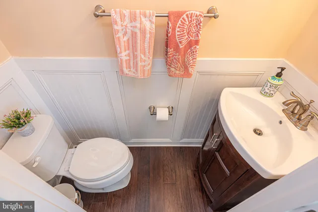 a bathroom with a granite countertop sink a mirror and a vanity