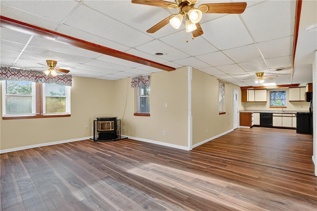 208 McCleary Road Aliquippa, PA 15001 - Photo 11 of 45 a view of an empty room with window and wooden floor