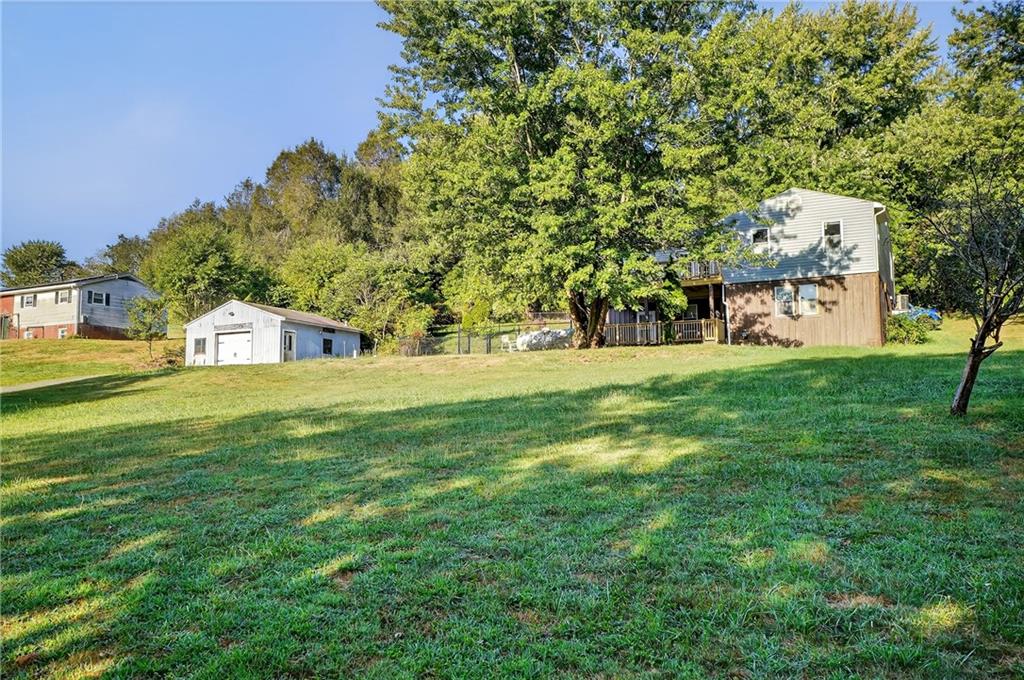 208 McCleary Road Aliquippa, PA 15001 - Photo 2 of 45 a view of a park with a house in the background