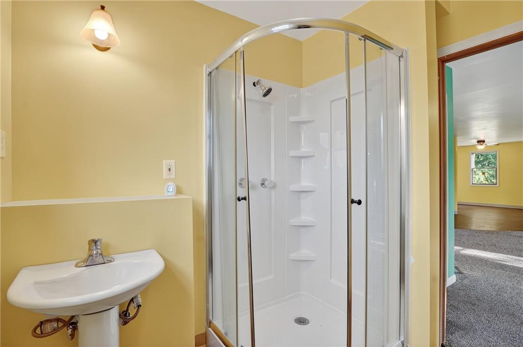 208 McCleary Road Aliquippa, PA 15001 - Photo 34 of 45 a bathroom with a sink a toilet and shower