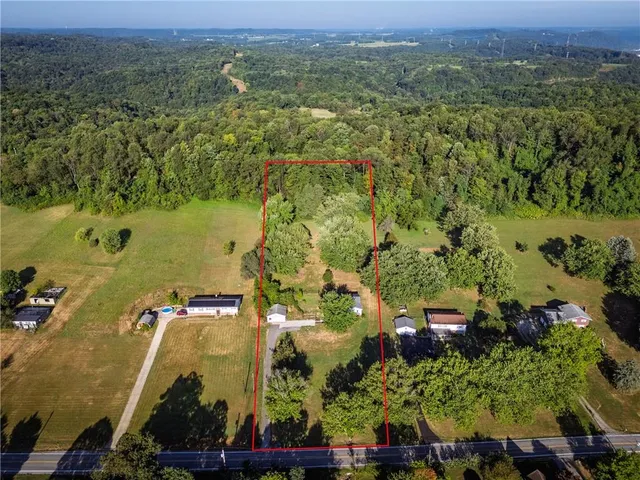 an aerial view of residential house with outdoor space