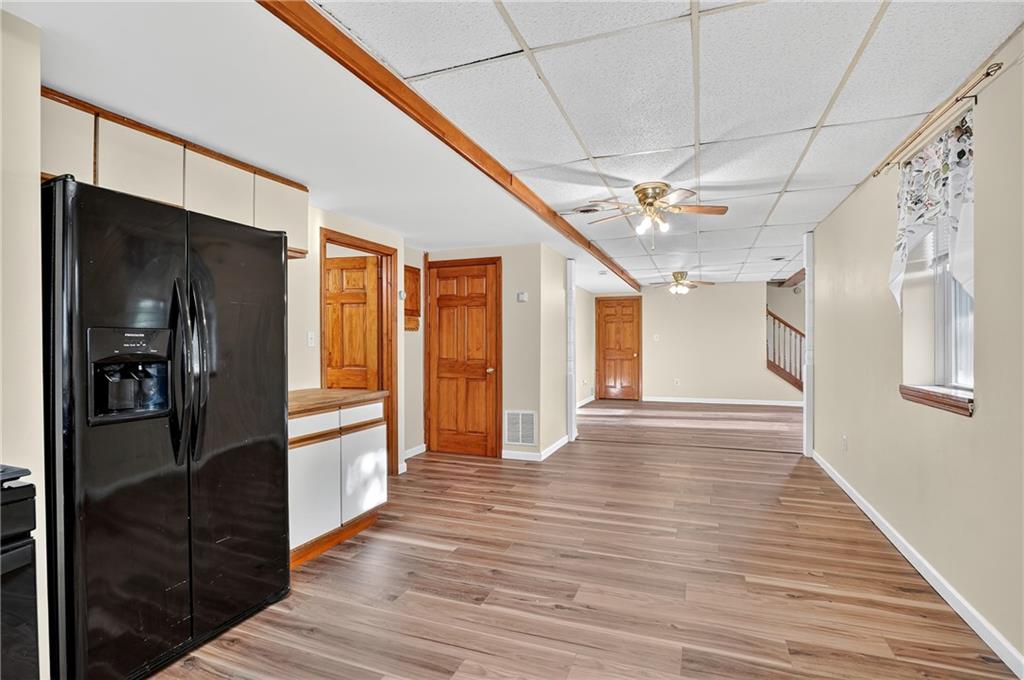 208 McCleary Road Aliquippa, PA 15001 - Photo 8 of 45 a view of a hallway with wooden floor and staircase