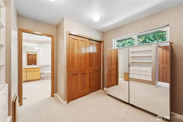 a view of an empty room and a window