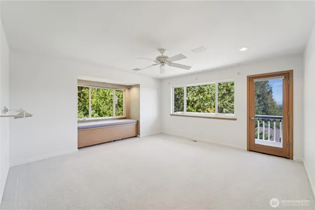 an empty room with windows and view