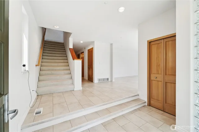 a view of a hallway with staircase