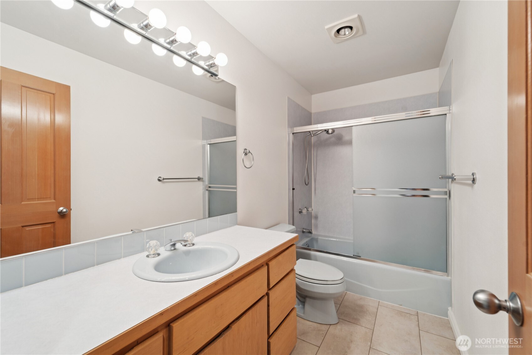 19749 53rd Avenue Northeast Lake Forest Park, WA 98155 - Photo 24 of 35 a bathroom with a sink a toilet and shower