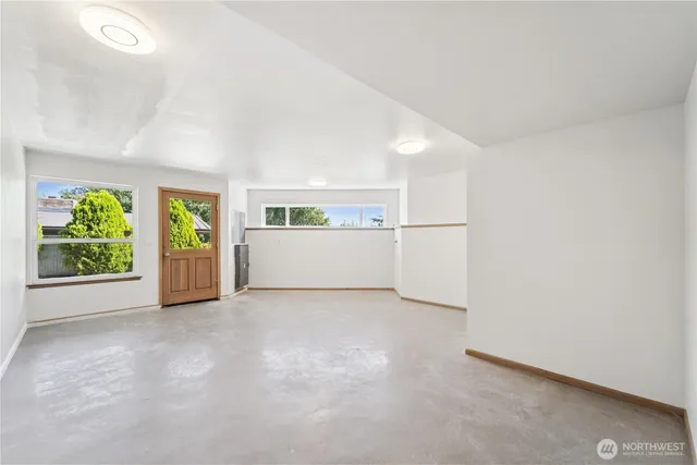 a balcony with wooden floor and fence