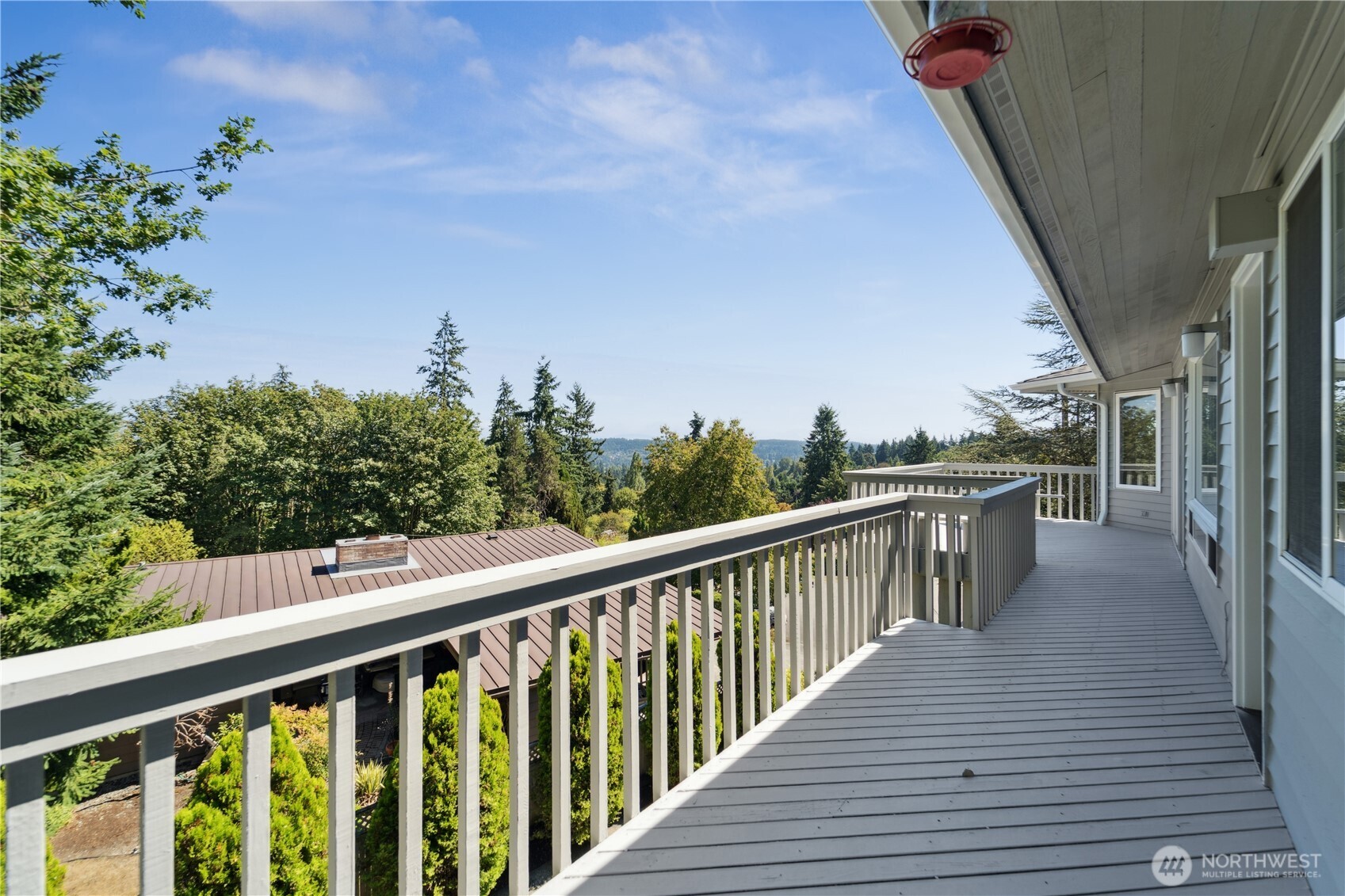 19749 53rd Avenue Northeast Lake Forest Park, WA 98155 - Photo 30 of 35 a balcony with wooden floor and fence
