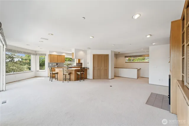 a view of a livingroom with furniture and a garage