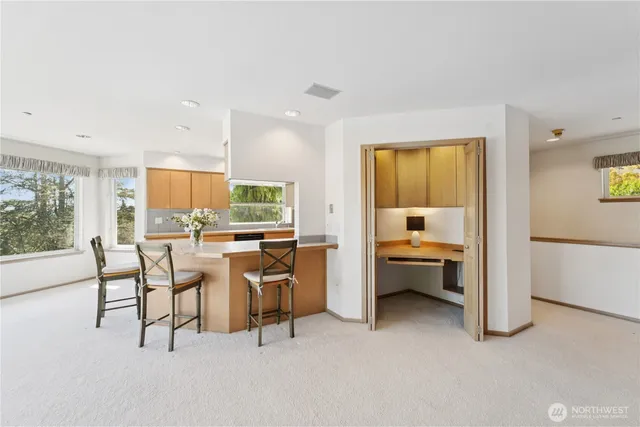 a view of a livingroom with furniture and window