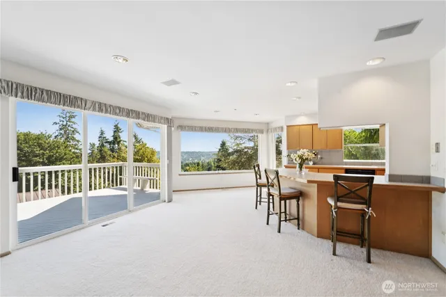 a view of a dining room with furniture window and outside view