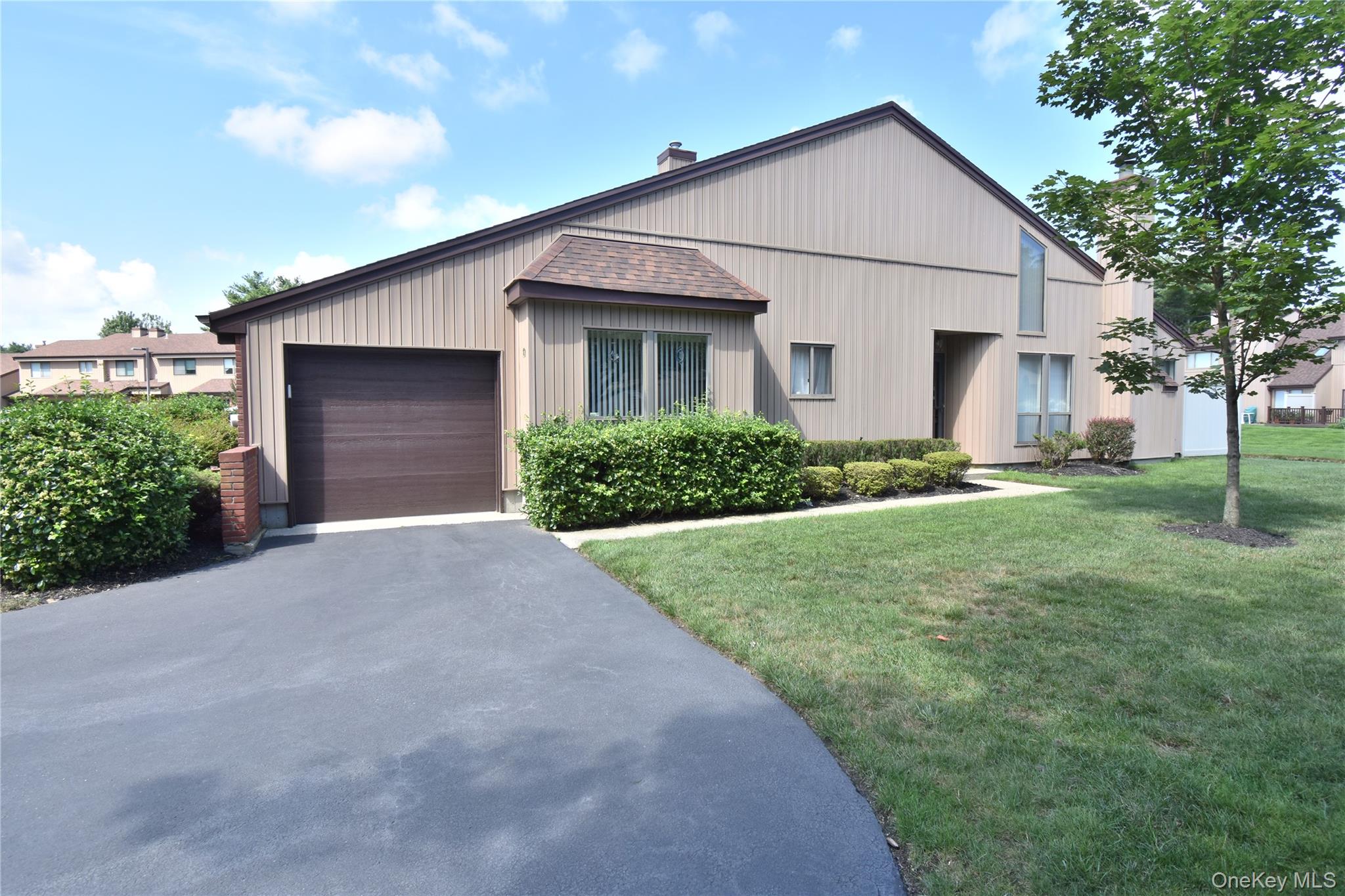 a view of a yard in front view of a house