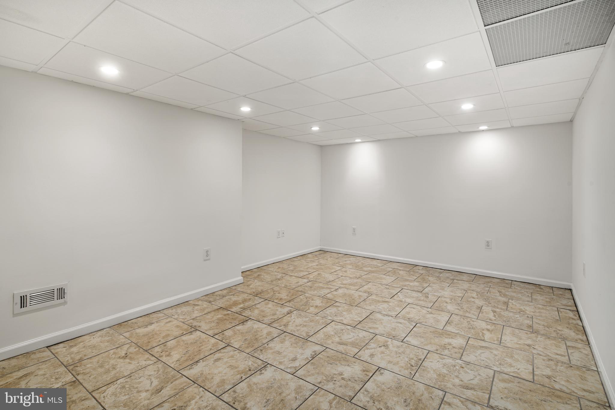 433 Haverford Road Wynnewood, PA 19096 - Photo 26 of 32 Finished BASEMENT w tile floor & recessed lighting