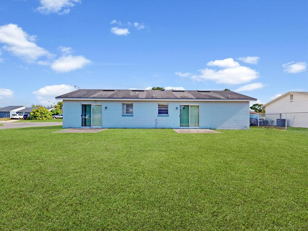 98 Pinata Court Kissimmee, FL 34743 - Photo 13 of 13 a view of a house with a backyard