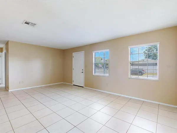 a view of an empty room with a window