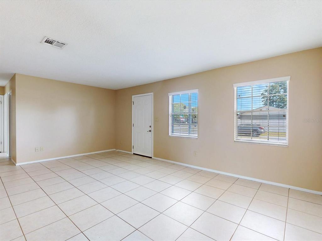 98 Pinata Court Kissimmee, FL 34743 - Photo 3 of 13 a view of an empty room with a window
