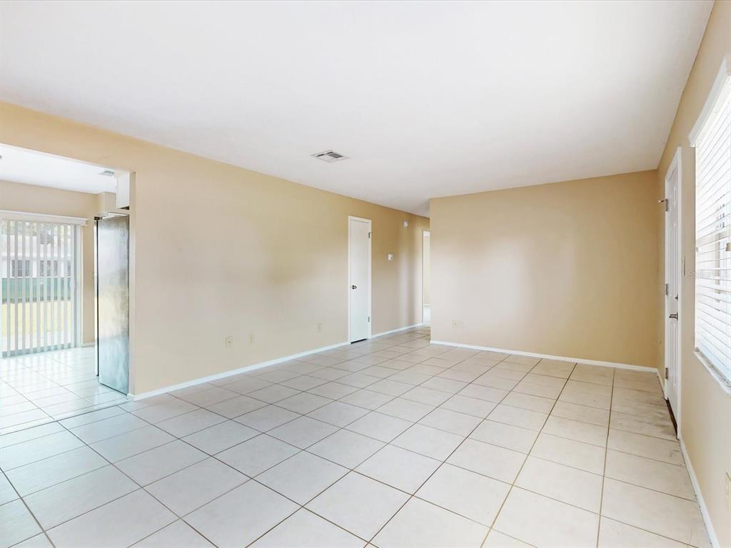 98 Pinata Court Kissimmee, FL 34743 - Photo 5 of 13 an empty room with windows