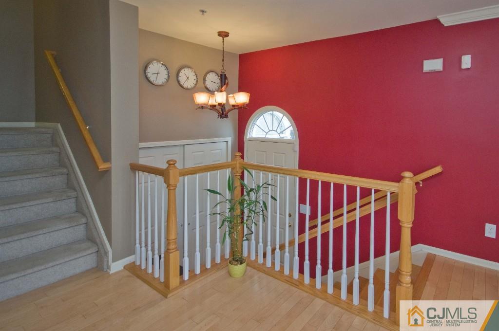11 Raritan Reach Road South Amboy, NJ 08879 - Photo 2 of 20 a view of staircase with railing and a chandelier