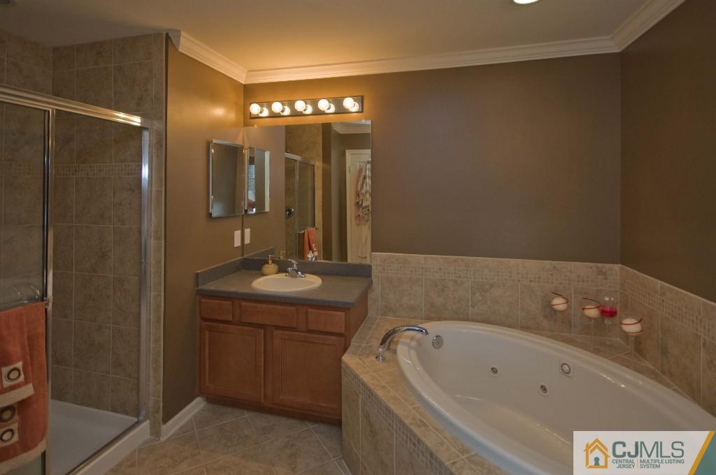 11 Raritan Reach Road South Amboy, NJ 08879 - Photo 11 of 20 a bathroom with a tub a sink and mirror