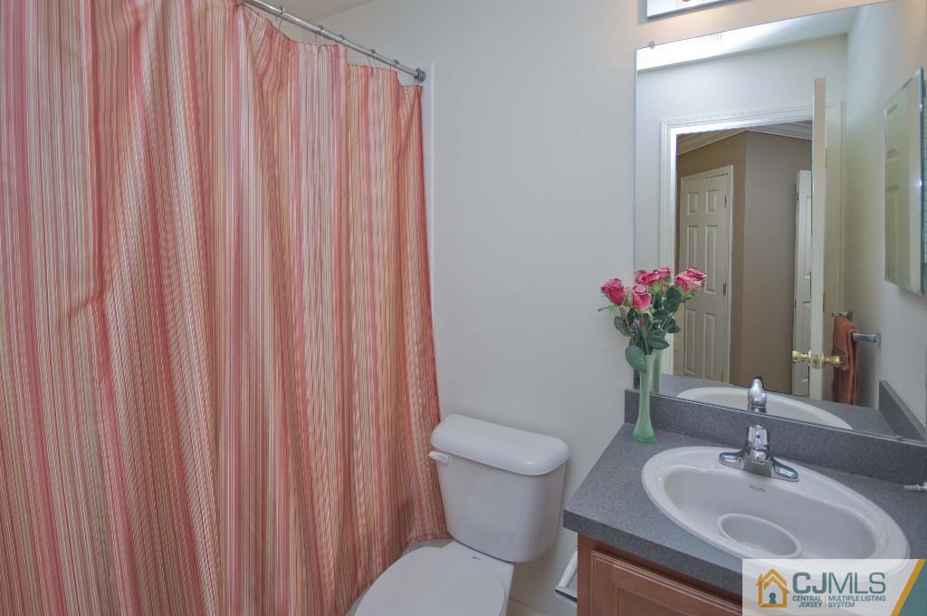 11 Raritan Reach Road South Amboy, NJ 08879 - Photo 13 of 20 a bathroom with a sink toilet and shower