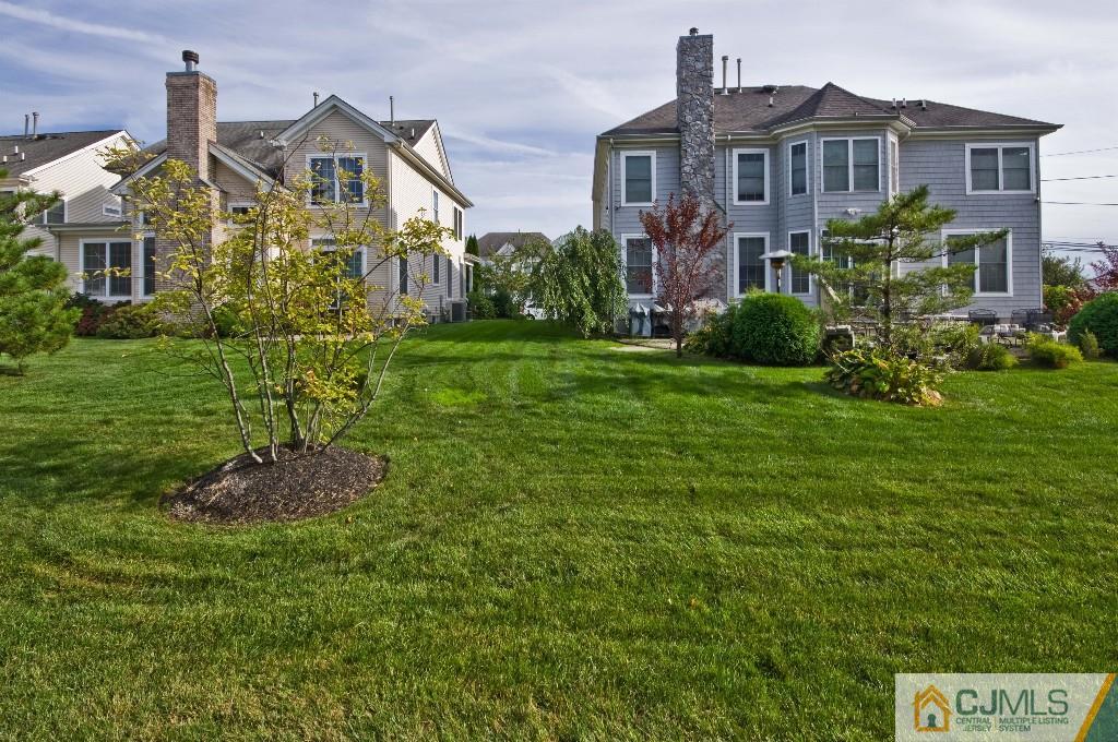 11 Raritan Reach Road South Amboy, NJ 08879 - Photo 15 of 20 a front view of a house with a garden