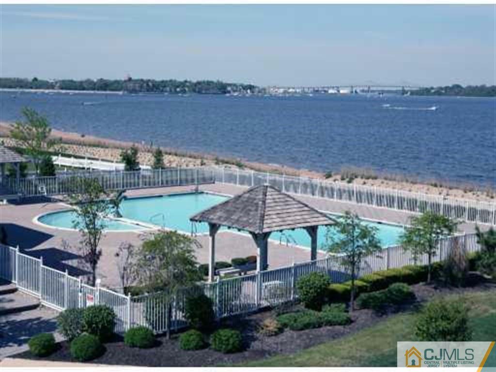 11 Raritan Reach Road South Amboy, NJ 08879 - Photo 19 of 20 a view of a house with a lake and a yard