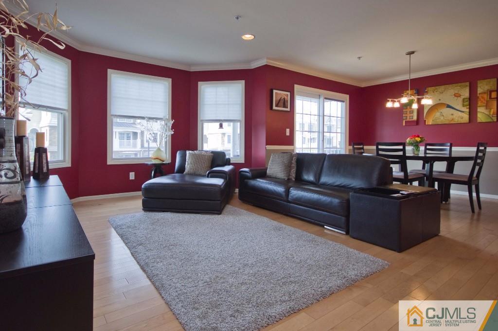 11 Raritan Reach Road South Amboy, NJ 08879 - Photo 3 of 20 a living room with furniture a large window and a flat screen tv