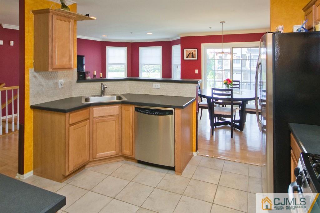 11 Raritan Reach Road South Amboy, NJ 08879 - Photo 5 of 20 a kitchen with a sink window and cabinets