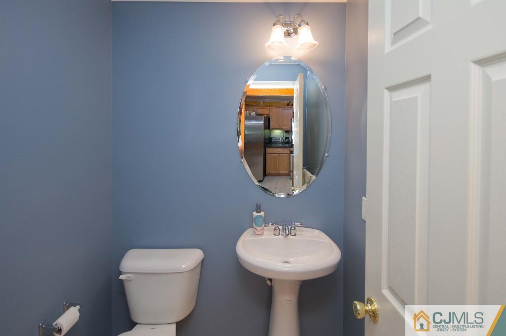 11 Raritan Reach Road South Amboy, NJ 08879 - Photo 8 of 20 a bathroom with a toilet sink and mirror