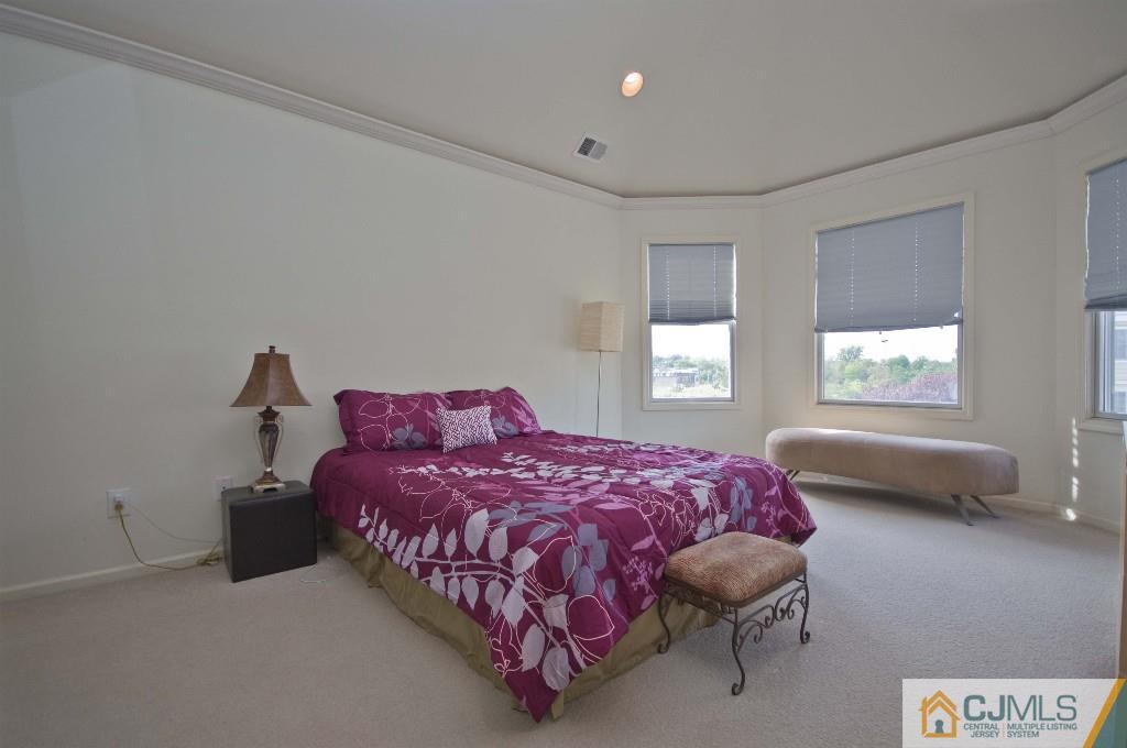 11 Raritan Reach Road South Amboy, NJ 08879 - Photo 9 of 20 a bedroom with a bed and window