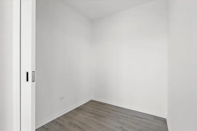 a living room with furniture and painting on the wall