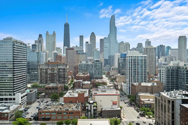 a view of a city with tall buildings