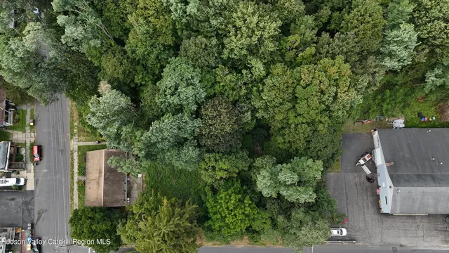an aerial view of a house with outdoor space and street view