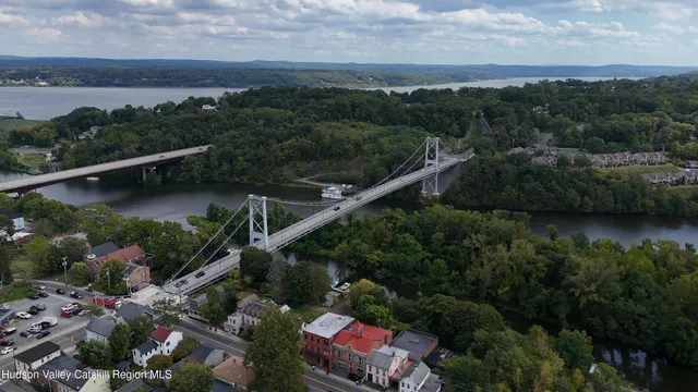 an aerial view of residential house with outdoor space and lake view
