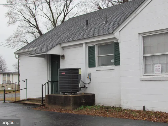 a front view of a house with stairs