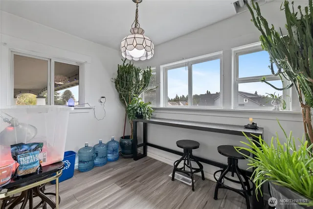 a view of a dining room with furniture window and wooden floor
