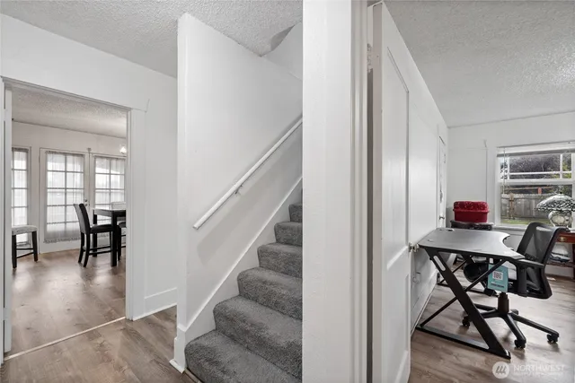 a view of a livingroom with furniture and a window