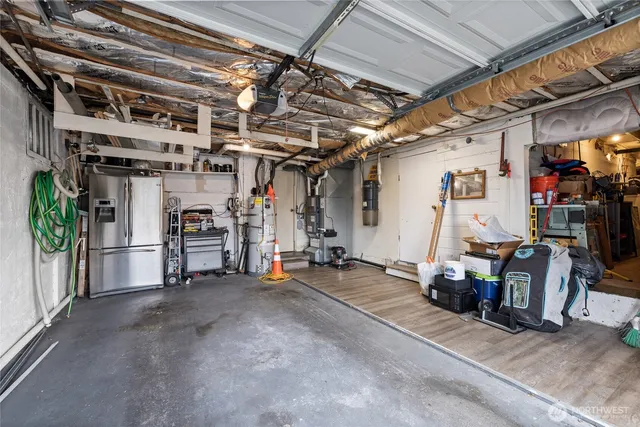 a backyard of a house with a garden and barbeque oven