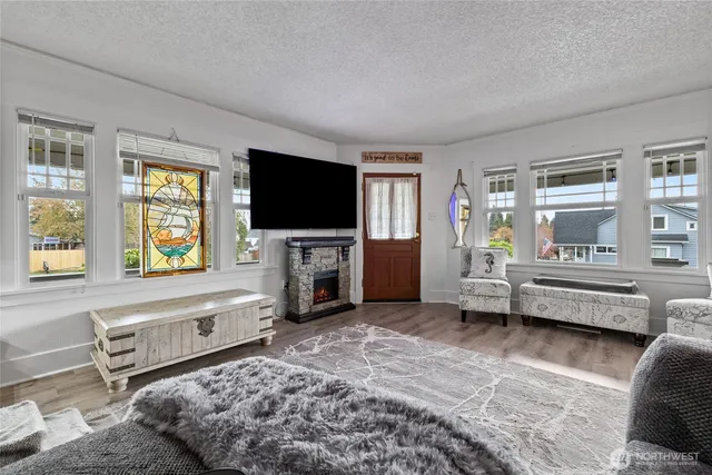 a living room with furniture and a flat screen tv