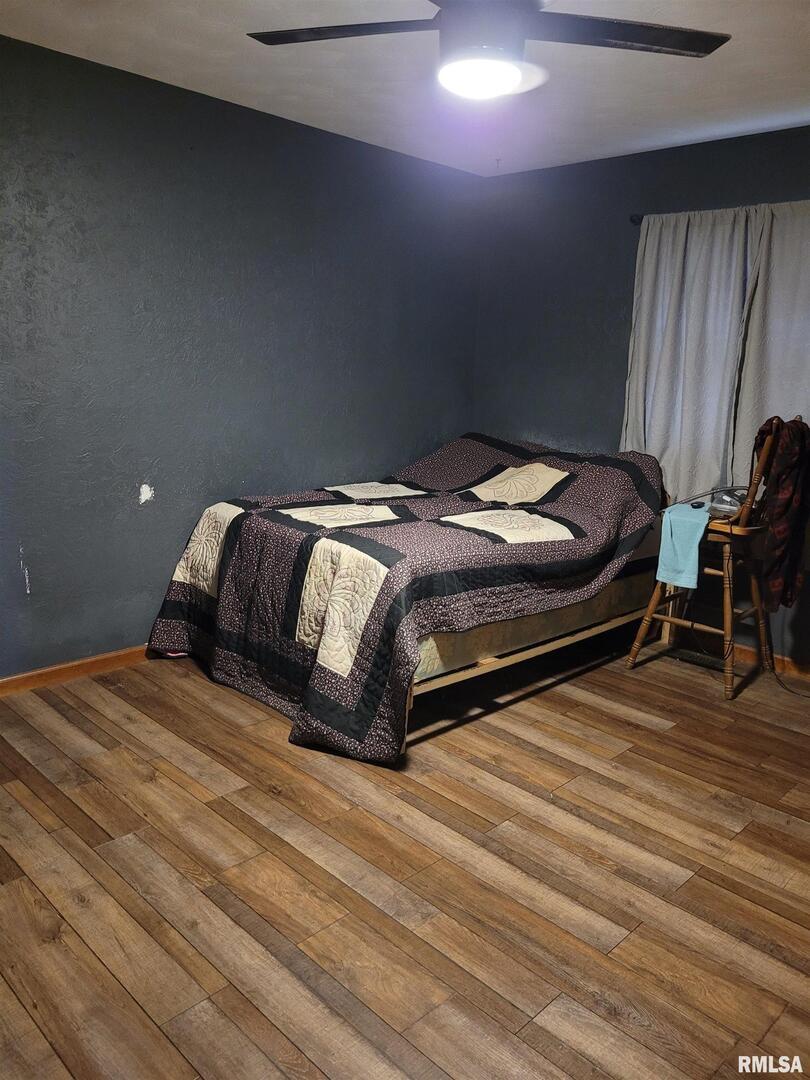 469 Main Street Radom, IL 62808 - Photo 13 of 23 a bedroom with a bed and a dresser