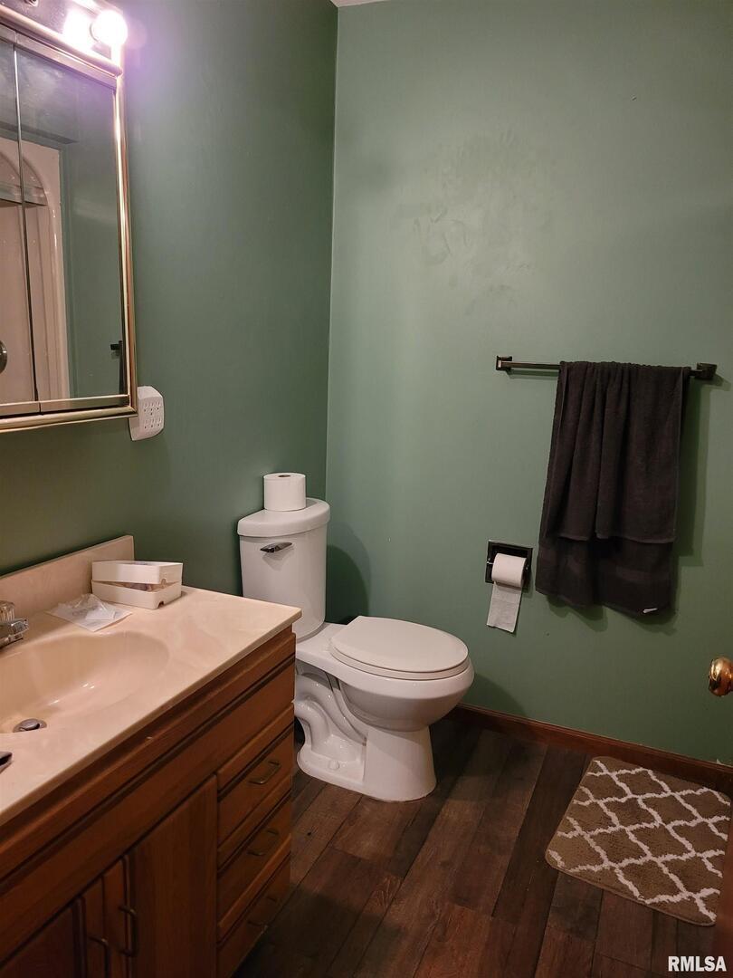 469 Main Street Radom, IL 62808 - Photo 14 of 23 a bathroom with a toilet and a mirror